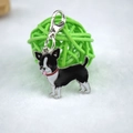 Detail of Boston Terrier enamel charm with silver lobster clasp on a woven ball - Black Chihuahua