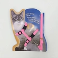 Detailed view of pink nylon cat harness and leash set on retail display card - Pink