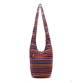 Detailed view of colorful ethnic striped patterns and front zipper on linen crossbody bag - Red