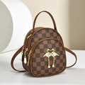 Classic brown checkered crossbody bag with gold flamingo clasp and pearl tassel detail - Coffee
