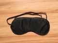 Black silk sleep mask with elastic ear straps and satin finish on wooden surface - Bulk No Nose Pad Style