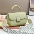 Detail of light green pebbled leather handbag with stylish geometric pattern wide strap - Green
