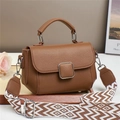 Brown lychee leather handbag with wide geometric strap and square metal buckle - Brown