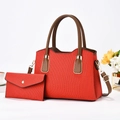 Red textured tote bag and matching envelope wallet set with brown handles and gold hardware - Red