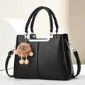 Classic black litchi pattern leather tote bag with silver metal bar and teddy bear charm - Black