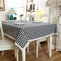 Close-up of black and white geometric triangle tablecloth with beige lace trim detailing - 60x60cm / With Lace Trim / Black and White
