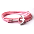 Pink braided nautical rope bracelet featuring a polished silver anchor metal clasp closure - Pink