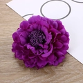 Top view of a purple fabric peony hair clip featuring layered petals and intricate stamens - Dark Purple