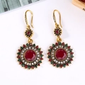 Vintage bohemian sunflower earrings in gold with red and green gemstone accents - Antique KC Gold + Red