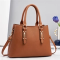 Elegant caramel brown textured leather handbag for women with gold hardware and strap - Earthy Yellow