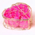 Pink soap roses inside a heart-shaped golden metal gift basket on plush pink background - Rose Red