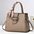 Minimalist beige textured leather handbag with quilted pattern and silk scarf handle - Khaki