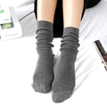 Japanese style dark grey slouch socks for women with ribbed cotton texture in a home setting - One Size / Dark Gray
