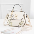 Elegant white PU leather handbag with floral embroidery and pearl H-clasp closure - White