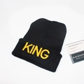 Close-up of black ribbed knit beanie with yellow 3D embroidered KING text and decor - M / Black / KING Embroidery / Gold