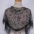 Close-up of black lace triangle veil with white floral embroidery and tassel fringe - 125-36cm / Black