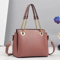 Elegant dusty pink litchi leather handbag with gold chain details and crossbody strap - Dusty Pink