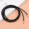 Knotted black woven waist belt with metallic tips for dresses and versatile styling - Black