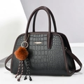 Fashionable black faux crocodile handbag with dark brown handles and golden buckle detail - Medium / Black