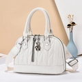 Chic beige pleated handbag with quilted pattern and decorative bear pendant - White