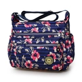 Dames crossbodytas van nylon met blauwe strepen en bloemmotieven met diverse ritsvakken - Blauwe grote bloemenprint