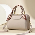 Chic beige lychee leather Boston bag with houndscarf handle and gold hardware - Gray
