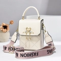 Minimalist beige crossbody bag with quilted pattern and gold swan pearl pendant detail - Off-white