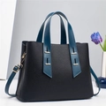Chic black lychee leather tote bag with navy blue handles and adjustable strap - Black