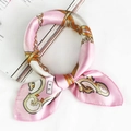 Pink and white silk scarf with golden chain pattern tied in a soft bow style - 5028 Pink White Gold Chain Crest