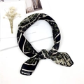 Elegant black and gold silk-like square scarf with architectural patterns tied styling - Black Clock