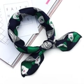 Women's silk neck scarf featuring an abstract blue and green face print on a magazine - Green Haired Witch