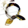 Ginger yellow and black artistic printed silk scarf styled in an elegant knotted loop - Pony