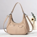Detailed view of beige hobo shoulder bag with silver rivets and decorative pockets - Khaki