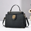 Elegant black woven leather crossbody bag with round gold horse emblem for women - Black