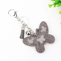 Sparkly grey butterfly keychain with rhinestones and matching tassel accessory - Gray