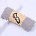 Rolled grey cotton linen scarf with a brown paper wrap featuring a black letter B - 160*50CM / Light Gray