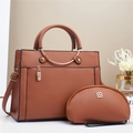 Brown lychee leather tote bag set with metal padlock and clover hardware detail - Caramel color
