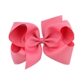 Detailed view of a large bright pink grosgrain ribbon hair bow with layered design - 7.5cm (3 inches) / Pink