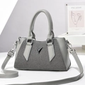 Chic gray pillow bag featuring minimalist patchwork and a silver V logo with shoulder strap - Gray