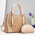 Detail view of khaki two-piece handbag set with geometric texture and gold hardware - Khaki
