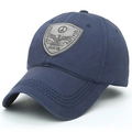 Men's navy blue cotton baseball cap featuring an embroidered shield patch and grey stitching - Adjustable / Navy Blue