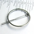 Minimalist silver metal hair clip with geometric circular design on vintage paper background - Round / Silver
