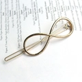 Elegant gold infinity shaped metal hair clip with a polished finish for women - Infinity / Gold