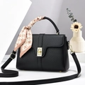 Minimalist black litchi grain leather handbag with gold lock and houndstooth silk scarf - Black