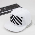 Detail of diagonal stripe embroidery on a white flat-brim hip-hop cap with cotton texture - White