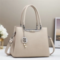 Chic beige crossbody handbag with vertical geometric embossing and pearl star charm - Apricot