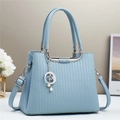 Elegant light blue embossed leather handbag with moon and star charms for women - Blue
