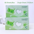 Two boxes of disposable cotton face towels with green lily floral pattern packaging - Standard Style (Boxed)