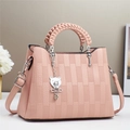 Elegant pink embossed leather handbag with woven handle and bear charm for women - 26x12x20cm / Pink