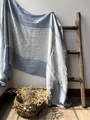 Detail showing the blue and white striped cotton fabric texture hanging on a wooden ladder - Sky Blue Stripe